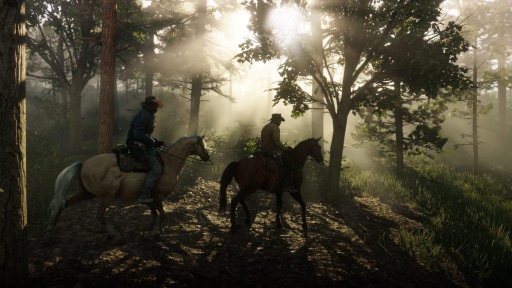 Red Dead Redemption 2 - cowboys on horseback riding through a forest with sunlight shining through the trees