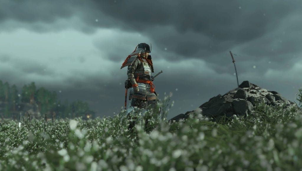 Ghost of Tsushima - armored Jin Sakai standing in a field