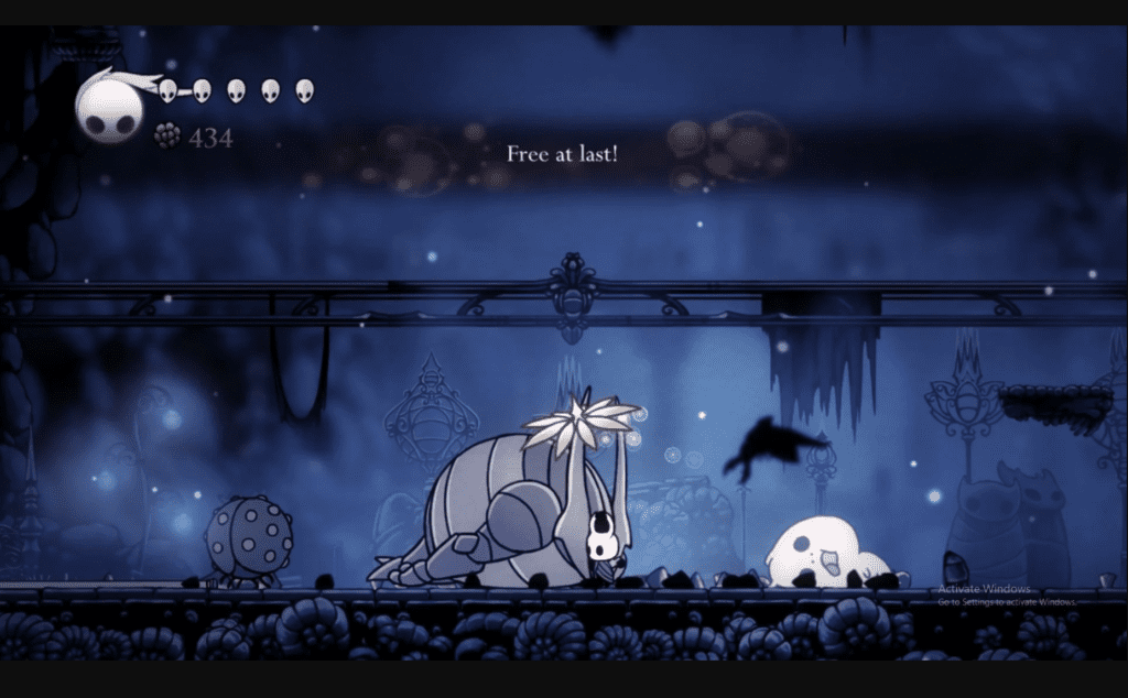 A screenshot from Hollow Knight in 2017 when a spirit of a boss flies away, shouting, "Free at last!" 