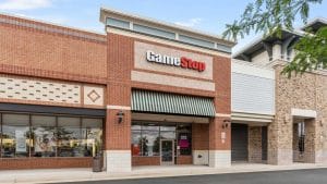 A picture of a GameStop storefront in an outdoor strip mall