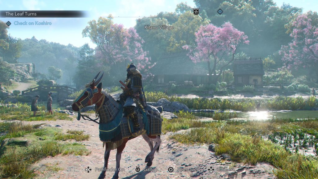 Yasuke is atop his horse, Kikai, and they ride in matching samurai armor through Japanese farm fields in the spring.