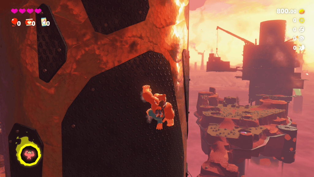 Donkey Kong Bananza Review - screenshot of DK scaling a tower in the Canyon Layer