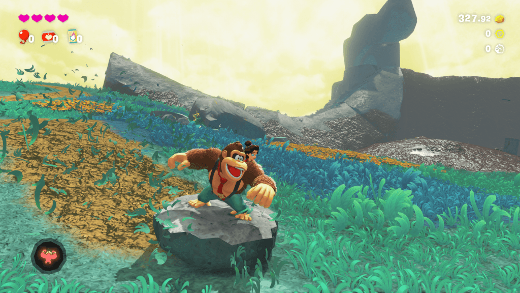 Donkey Kong Bananza Review - screenshot of DK sliding on a rock in the Hilltop Layer