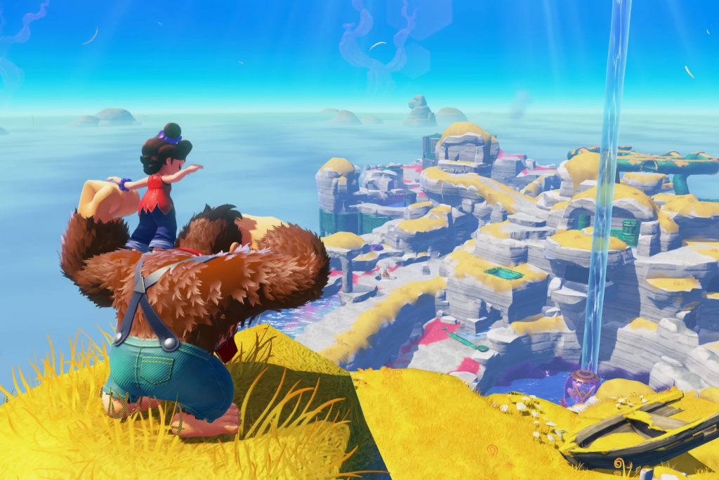 Donkey Kong stands on a cliff looking over a rocky map in the Lagoon layer with Pauline on his shoulders. 