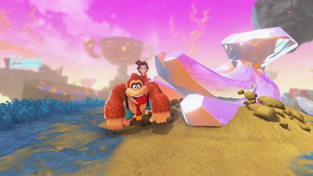 Donkey Kong traveling through a rocky map on his hands and knees, with Pauline riding on hsi back. 