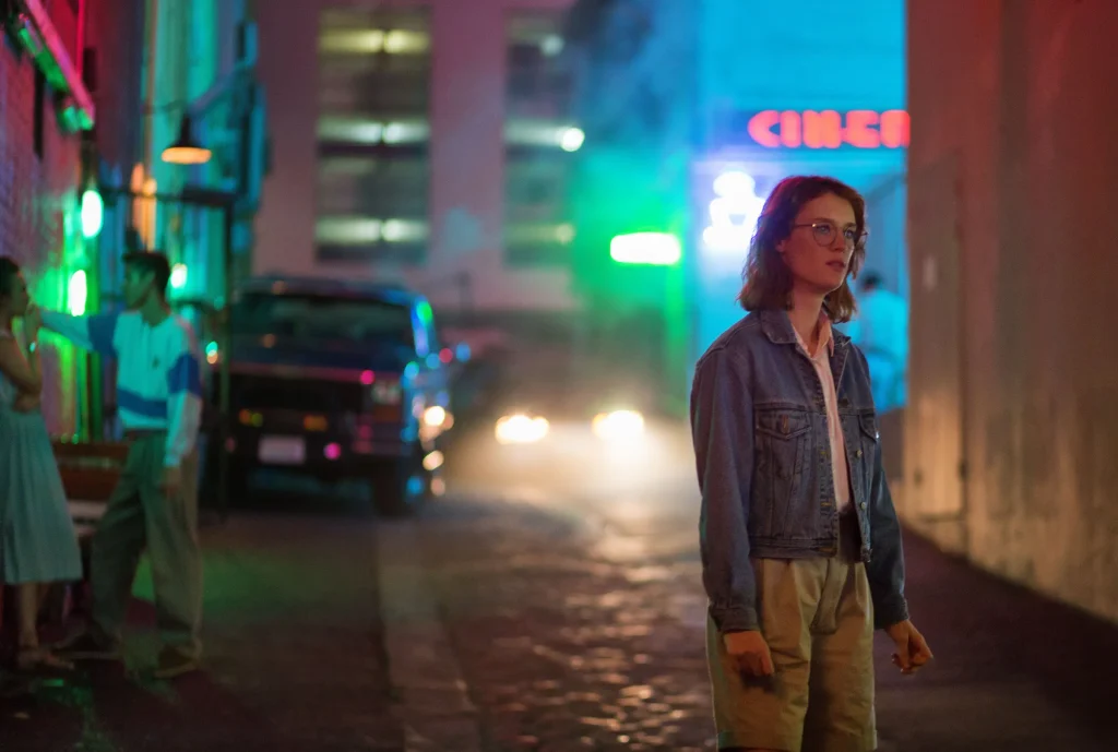 Black Mirror, "San Junipero" - Mackenzie Davis walking through a virtual world while her real-world character is old and dying