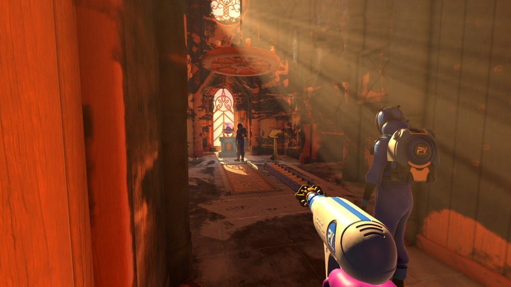 PowerWash Simulator 2 review - screenshot of the player standing next to other power washers with some ambient lighting filtering in from the windows