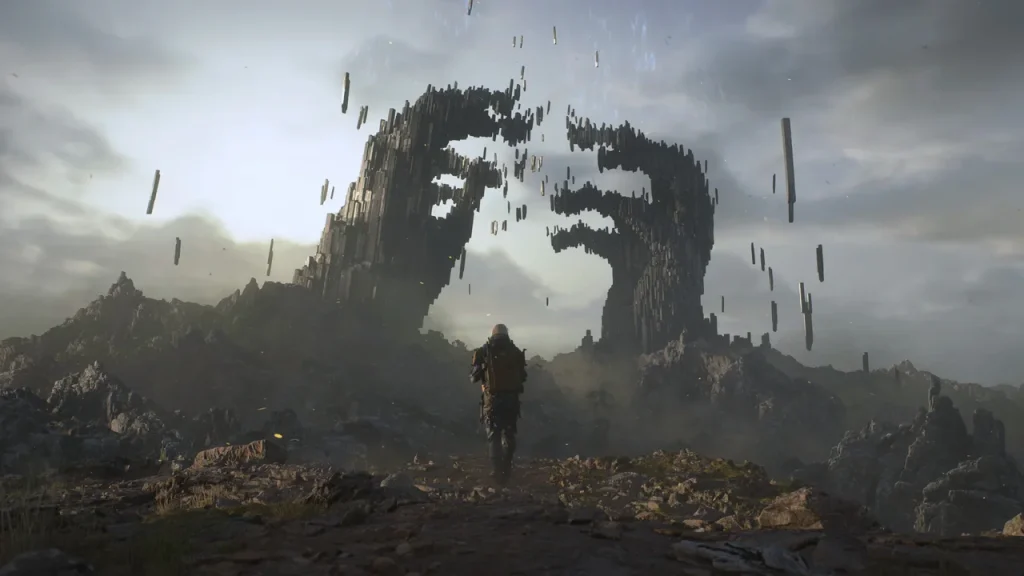 A screenshot from Death Stranding 2 of a character walking to two mysterious mountains shaped like hands