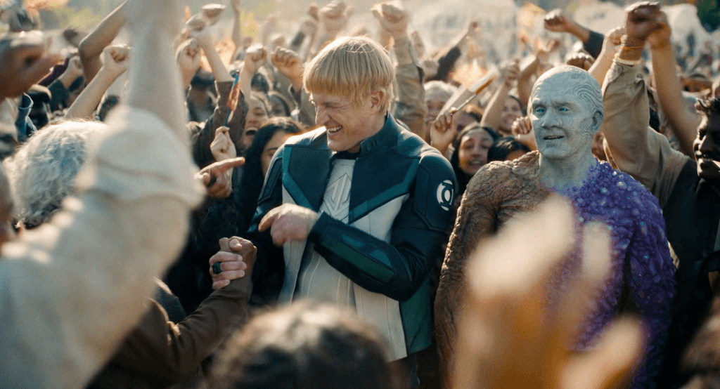 A screenshot from the 2025 Superman film showing the Justice Gang receiving gratitude from happy people.