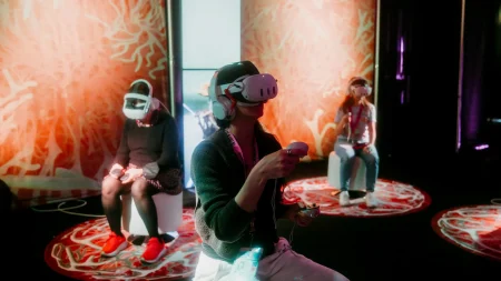 A photo of three people with VR headsets on at SXSW 2025.