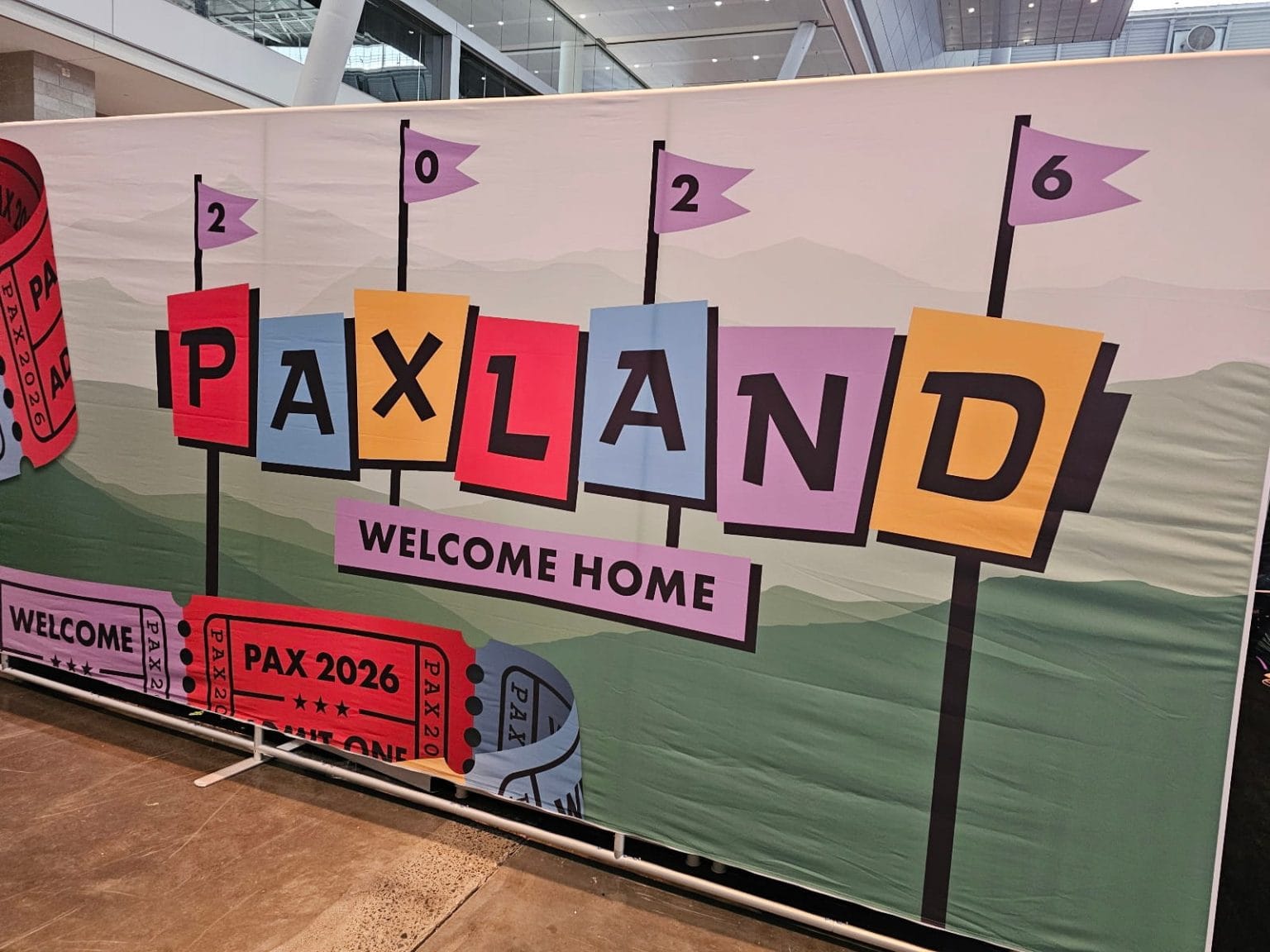 Screenshot of a sign at PAX East 2026, saying "PAXLAND, Welcome Home"