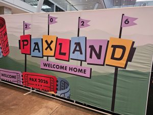Screenshot of a sign at PAX East 2026, saying "PAXLAND, Welcome Home"