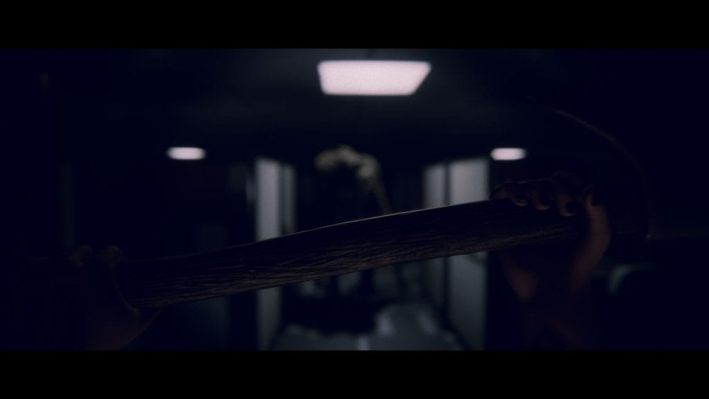 A screenshot from psychological horror game Project Songbird showing a close-up view of an axe and an other-worldly enemy out of focus beyond. 