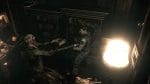 Resident Evil HD - Chris Redfield fighting off a zombie with a shotgun in a dimly lit room
