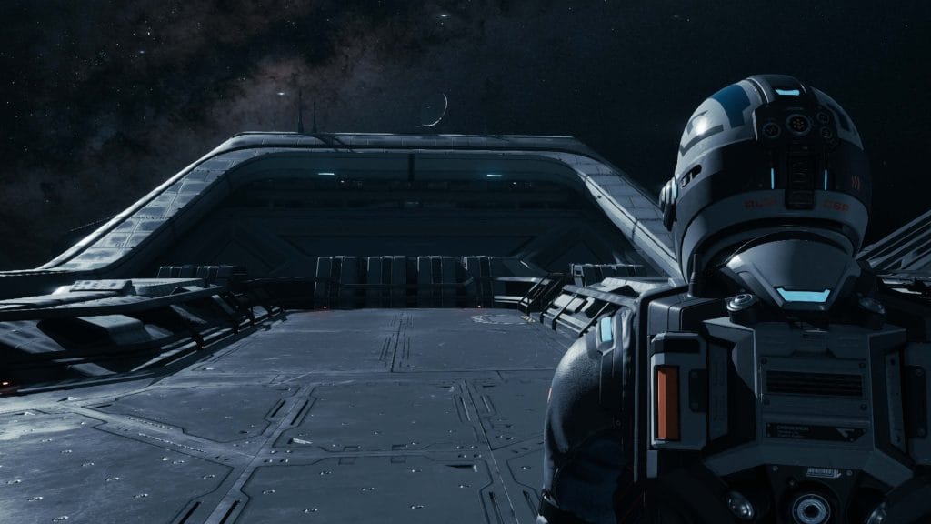 In a Directive 8020 review, a screenshot of the game showing a person walking on a spaceship alone