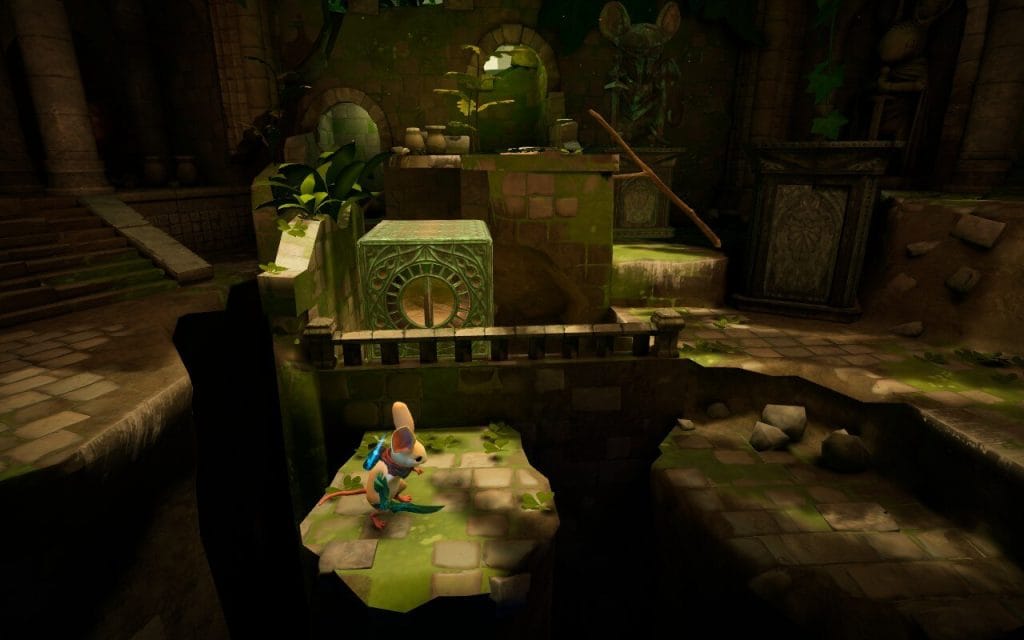 Moss: The Forgotten Relic - a screenshot for a review showing Quill, a mouse, standing a castle dungeon with mossy rocks.