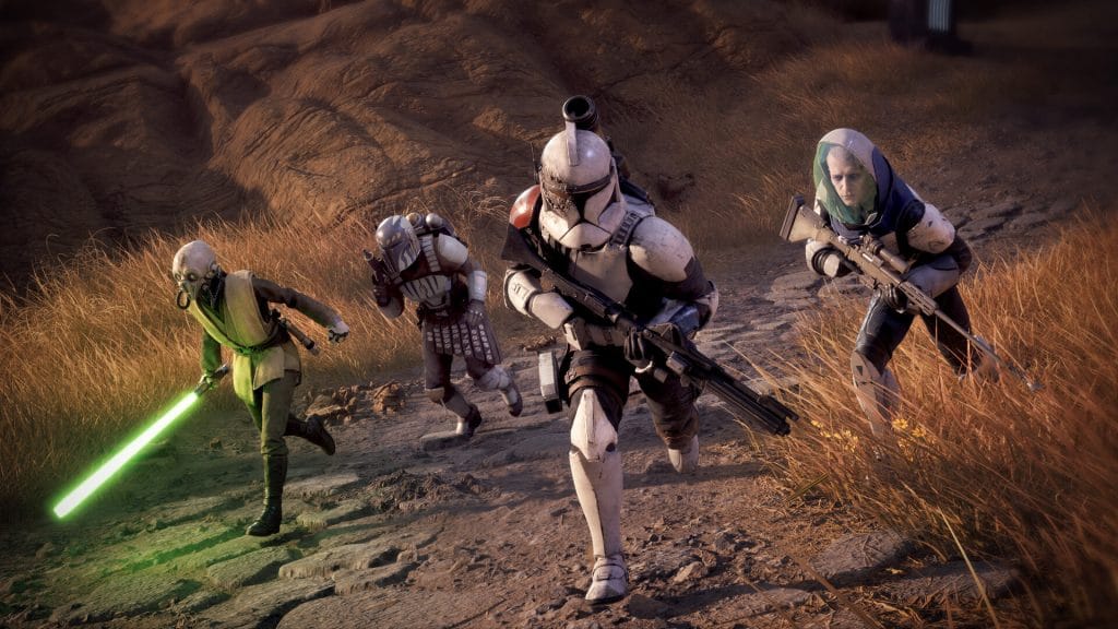 Star Wars Zero Company - promotional screenshot of a jedi holding a green lightsaber, a Mandalorian with a pistol, a storm trooper with a rifle, and an alien sniper all running toward the camera