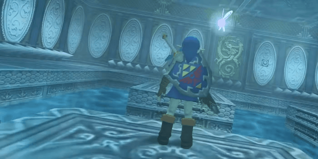 Ocarina of Time’s Water Temple Is Great the Way It Is The Legend of Zelda: Ocarina of Time - picture of Link in a blue tunic standing on a platform, his back facing the camera, with Navi hovering around his right shoulder