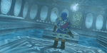 The Legend of Zelda: Ocarina of Time - picture of Link in a blue tunic standing on a platform, his back facing the camera, with Navi hovering around his right shoulder