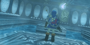 The Legend of Zelda: Ocarina of Time - picture of Link in a blue tunic standing on a platform, his back facing the camera, with Navi hovering around his right shoulder