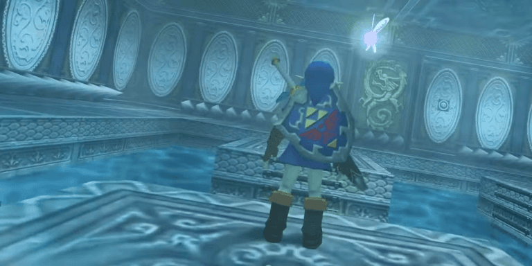 Ocarina of Time’s Water Temple Is Great the Way It Is The Legend of Zelda: Ocarina of Time - picture of Link in a blue tunic standing on a platform, his back facing the camera, with Navi hovering around his right shoulder