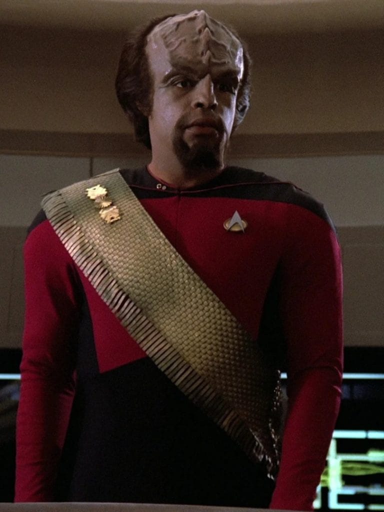 Photo of the Klingon Worf from Star Trek: The Next Generation. He's wearing red with a gold sash around his body
