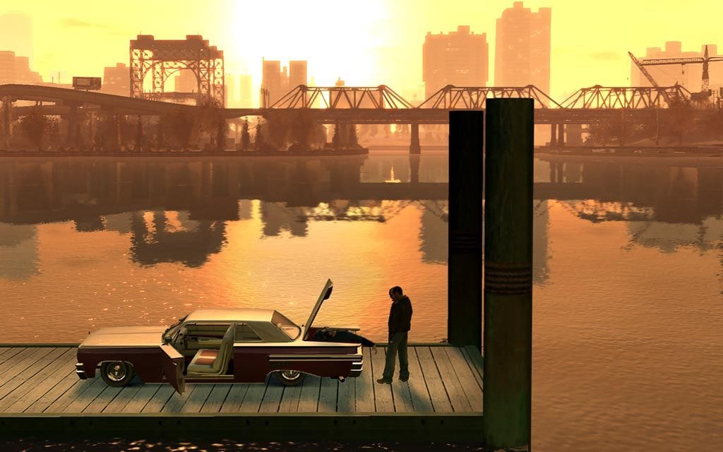 Grand Theft Auto IV - photo of Niko Bellic overlooking a dead body in his truck as the sun sets