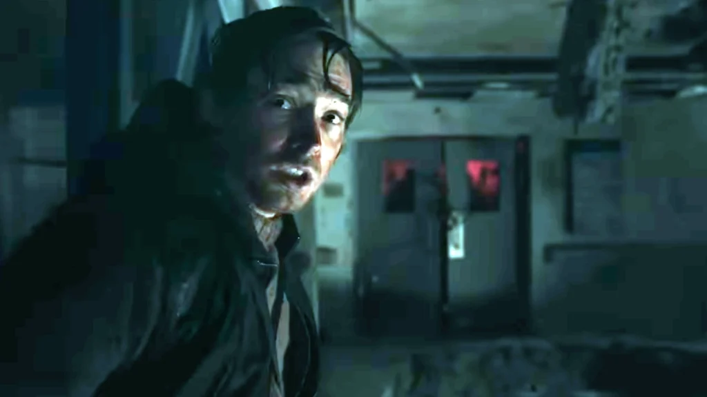 Resident Evil (2026 film) - Umbrella scientist in a dimly lit lab with a red glow emitting from doors behind him