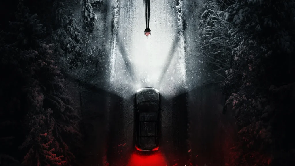 Resident Evil (2026 film) - promotional image of person walking on a snowy, foresty road at night while a car flashes bright lights at them