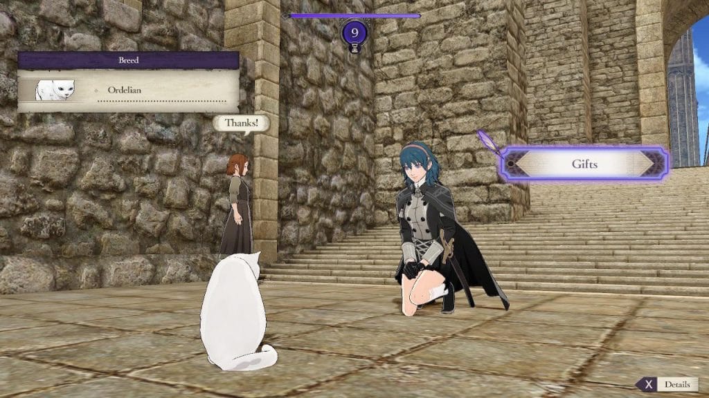 A screenshot of Fire Emblem: Three Houses showing a female Byleth smiling at a cat and giving it a gift in Garreg Mach.