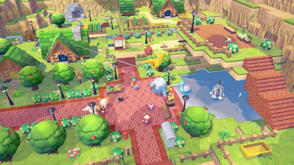 A screenshot of Pokemon Pokopia showing the town center with a fountain, vending machine, garden, and Pokemon walking around. 