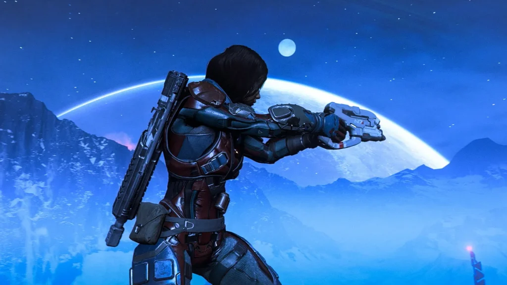 A screenshot of Mass Effect Andromeda of a woman walking with a gun held out with a large space vista behind her. This screenshot is featured in an op-ed about why the shut-down of BioWare is so sad and bad for the games industry.
